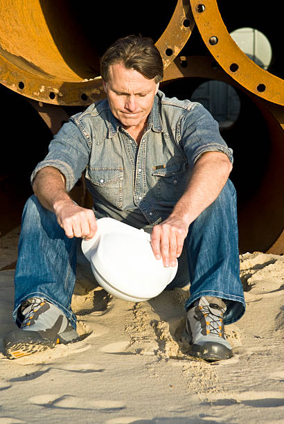 Depressed construction worker. stock photo