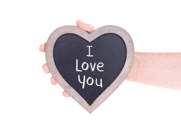 istock Adult holding heart shaped chalkboard 979920170
