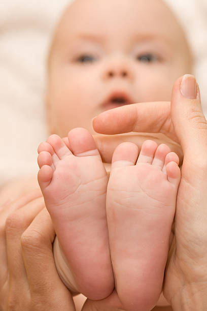 little feet baby stock photo