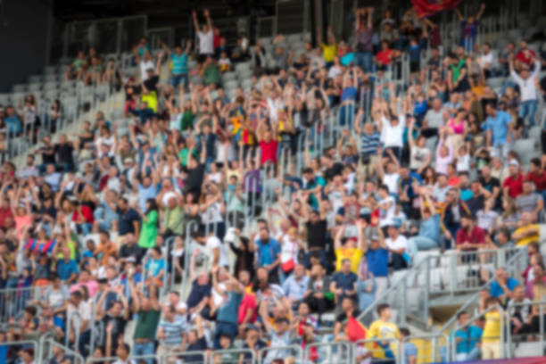 istock Blurred crowd of supporters 979925436