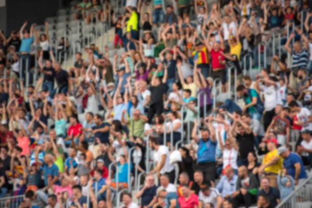 istock Crowd of people with raising hands 979925458