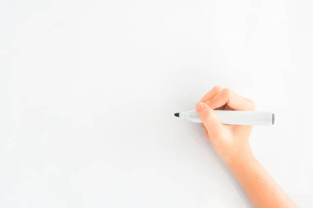 istock Close up Hand writing white background with pencil 979925790
