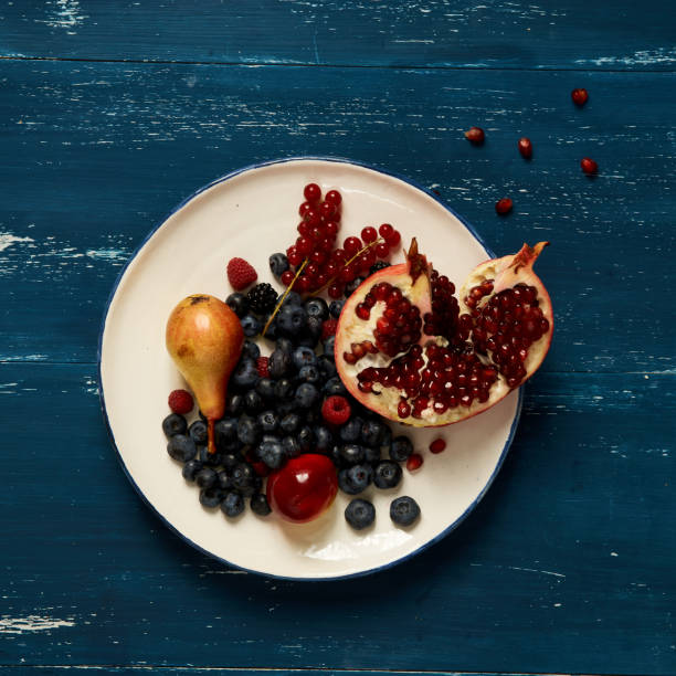 Fruits and berries lying on round plate