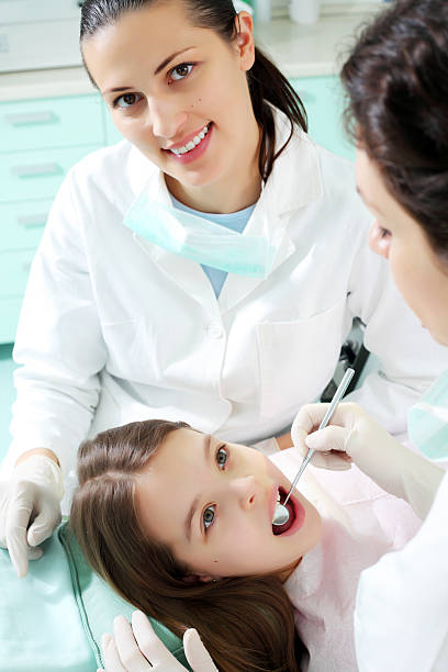 istock Little girl visiting a dentist. 97993278