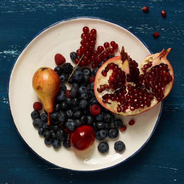 Fruits and berries lying on round plate