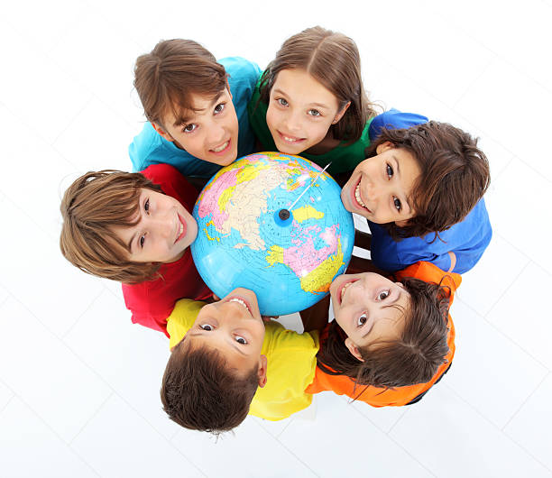 istock Kids holding together a terrestrial globe. 97993590