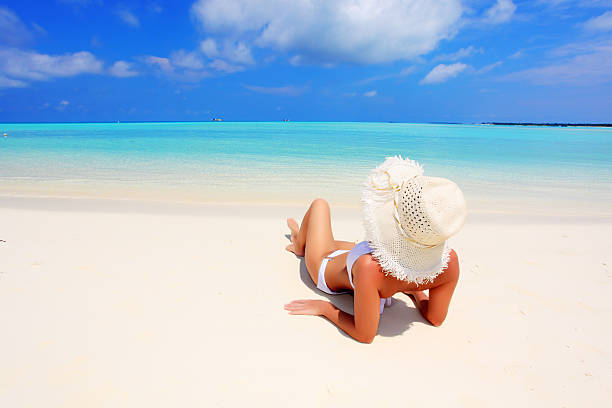 istock Pretty woman sunbathing on the beach. 97993601