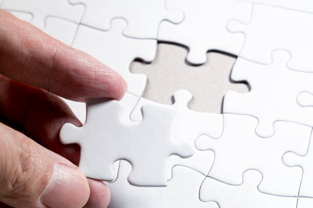 istock White Blank jigsaw puzzle, business concept of Solution 979937556