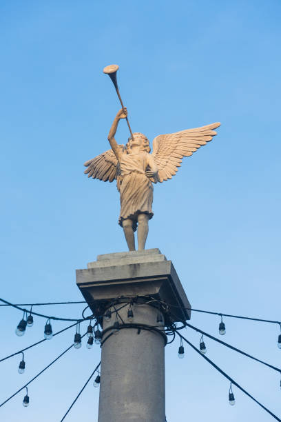 istock Angel Statue blowing trumpet 979937706