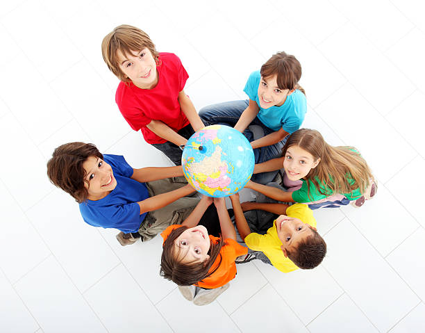 istock Kids holding together a terrestrial globe. 97993803