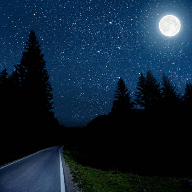 istock backgrounds night sky with stars and clouds. 979946214