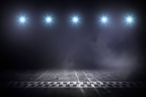 istock Race track finish line racing on night 979949516