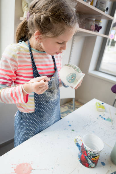 istock Girl creating a pottery cup 979949726