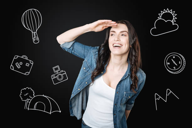 istock Happy woman looking into the distance while travelling 979960246