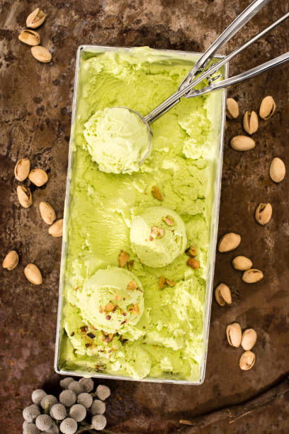 istock elevated view of pistachio ice cream with ice cream scoops on table 979960468