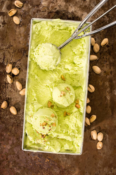 istock elevated view of pistachio ice cream with scoop on table 979960830