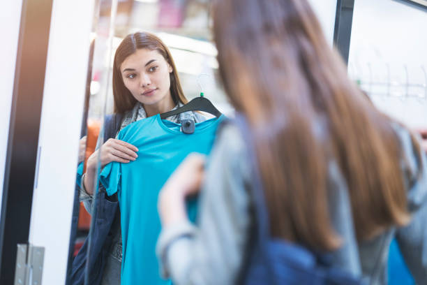 istock Woman looking at clothes 979961384