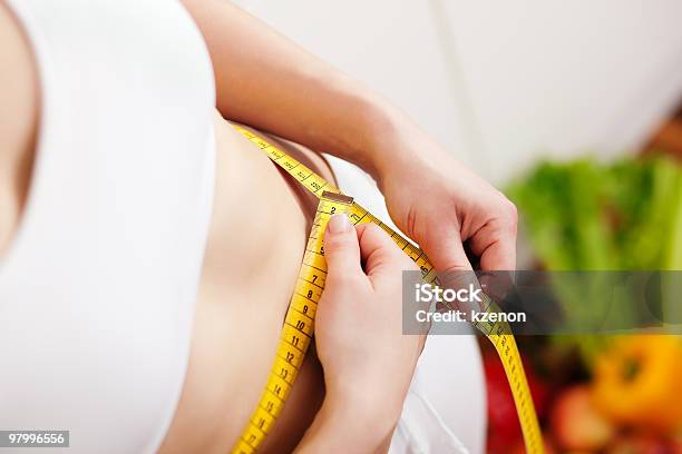 Woman Measuring Waist With Tape Stock Photo - Download Image Now - Adult, Body Conscious, Color Image