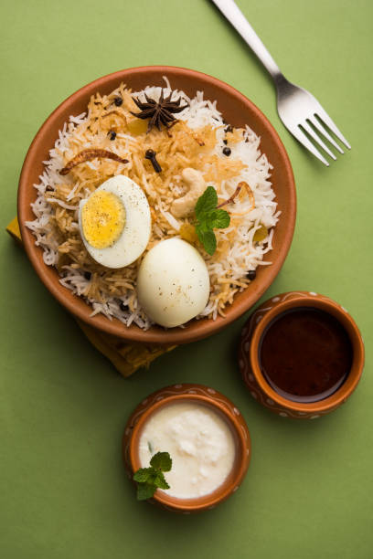 istock Egg Biryani - Basmati rice cooked with masala roasted eggs and spices and served with yogurt, selective focus 979966246