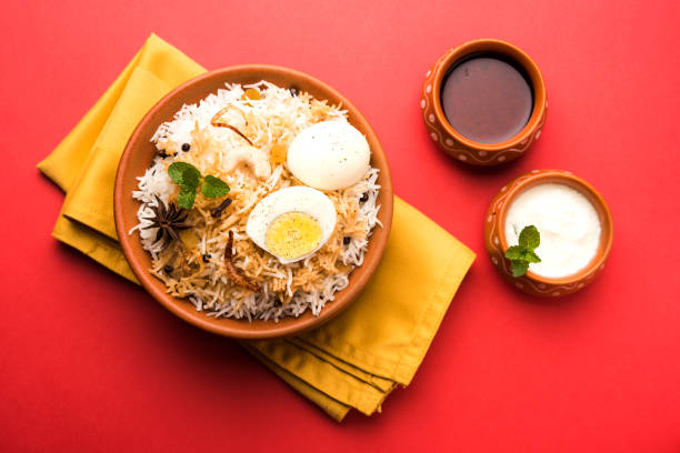 istock Egg Biryani - Basmati rice cooked with masala roasted eggs and spices and served with yogurt, selective focus 979966462