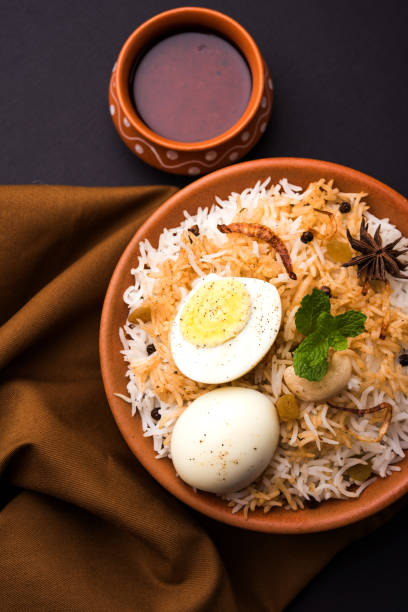 istock Egg Biryani - Basmati rice cooked with masala roasted eggs and spices and served with yogurt, selective focus 979966790
