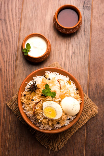 istock Egg Biryani - Basmati rice cooked with masala roasted eggs and spices and served with yogurt, selective focus 979967024