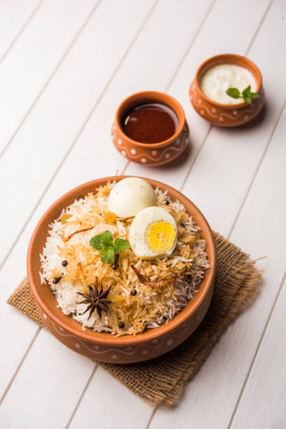 istock Egg Biryani - Basmati rice cooked with masala roasted eggs and spices and served with yogurt, selective focus 979967260