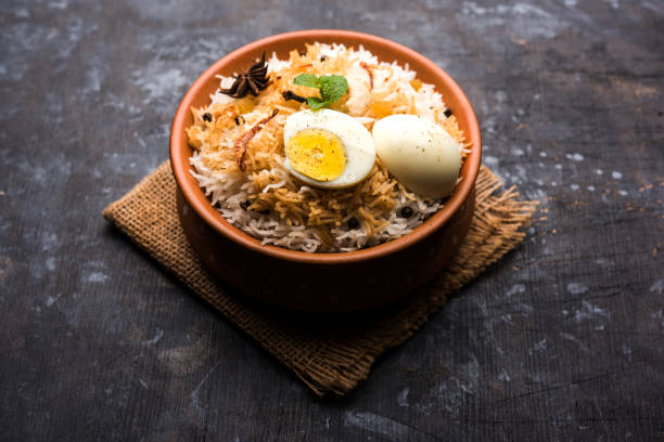 istock Egg Biryani - Basmati rice cooked with masala roasted eggs and spices and served with yogurt, selective focus 979967302