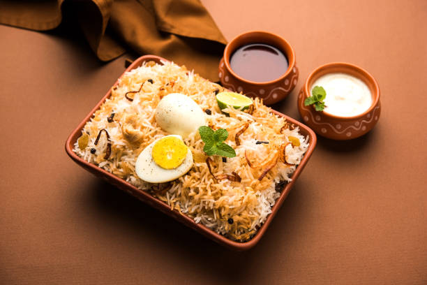 istock Egg Biryani - Basmati rice cooked with masala roasted eggs and spices and served with yogurt, selective focus 979967844