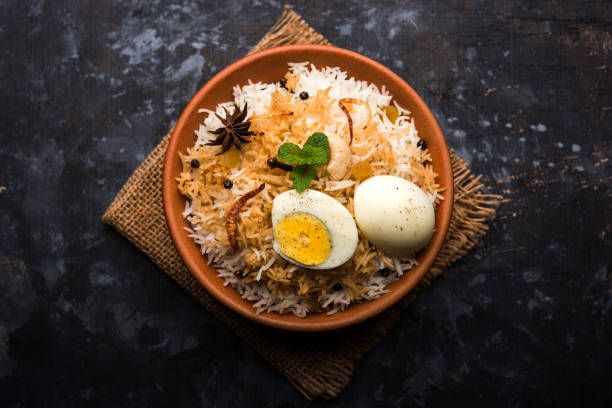 istock Egg Biryani - Basmati rice cooked with masala roasted eggs and spices and served with yogurt, selective focus 979967968