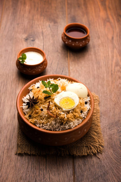 istock Egg Biryani - Basmati rice cooked with masala roasted eggs and spices and served with yogurt, selective focus 979968514
