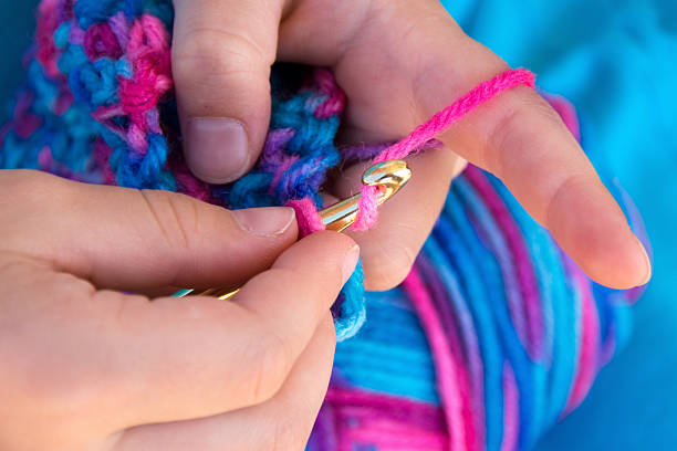 Close up of hands crocheting a blanket  crochet photos stock pictures, royalty-free photos & images