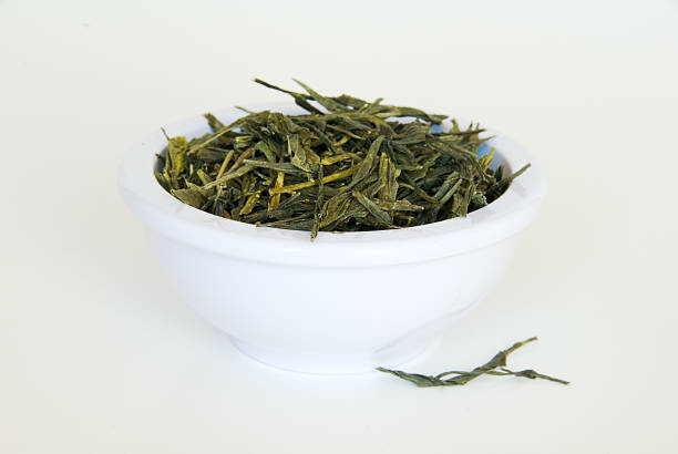 istock Green tea leaves in a bowl 97997096