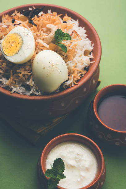 istock Egg Biryani - Basmati rice cooked with masala roasted eggs and spices and served with yogurt, selective focus 979971104