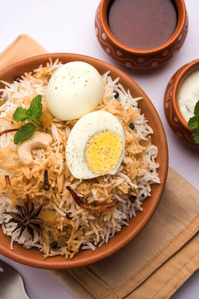 istock Egg Biryani - Basmati rice cooked with masala roasted eggs and spices and served with yogurt, selective focus 979971474