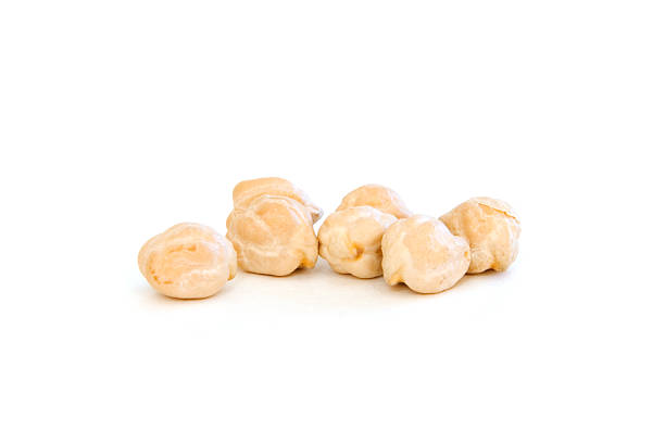 Several garbanzo beans on white  chickpea stock pictures, royalty-free photos & images