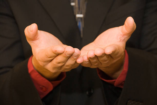 istock Hands of a businessman offering something 97997171
