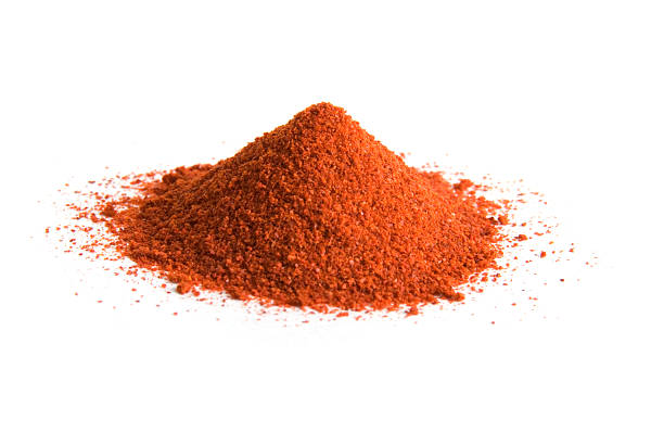 Pile of cayenne pepper on white  cayenne powder stock pictures, royalty-free photos & images