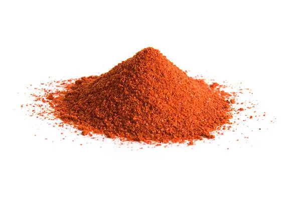 Photo of Pile of cayenne pepper on white