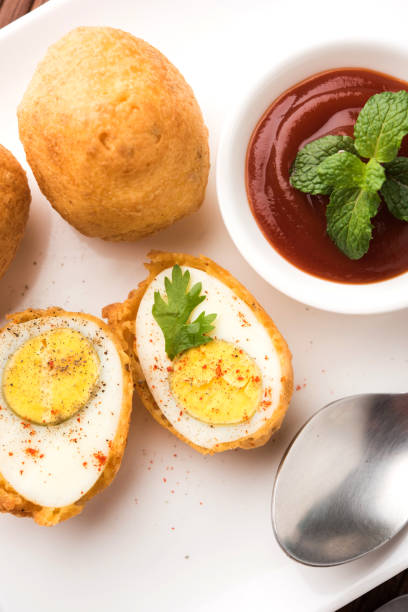 istock Tasty Egg Pakora or Pakoda served with tomato ketchup 979972010