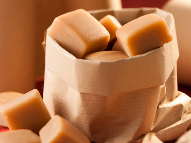 Closeup of caramel candy in a paper bag stock photo