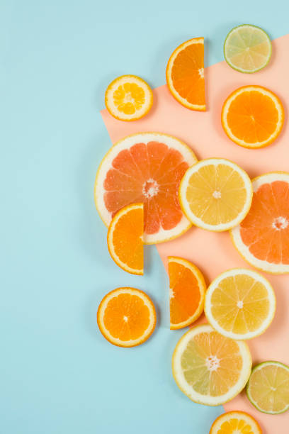 istock Citrus Fruits on Graphical Pastel Background 979975420