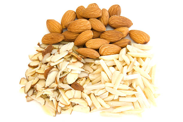 istock Piles of whole, sliced and silvered almonds on white 97997717