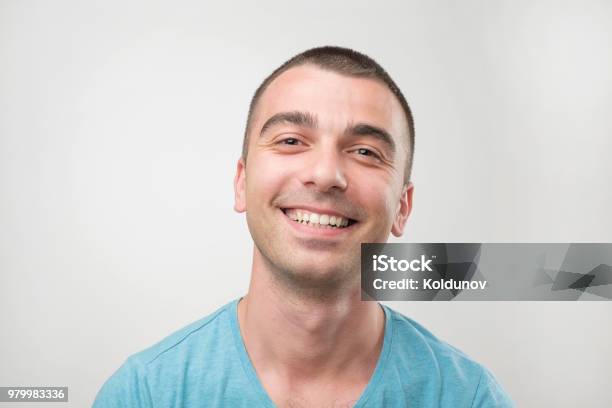 Closeup Ortrait Of Smiling Man In Blue Tshirt Stock Photo - Download Image Now - Adult, Adults Only, Beautiful People