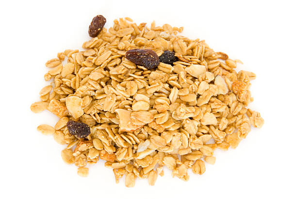 istock Pile of granola cereal on white 97998818
