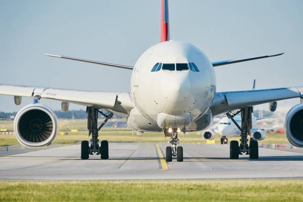 istock Sunny day at busy airport 979989908