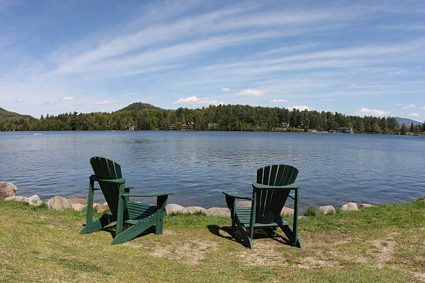 istock relaxing chairs by the lake 97999130