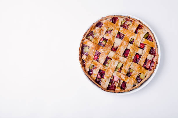 istock Toasted rye rhubarb pie with strawberry. Top view on white background with copy space 979994430