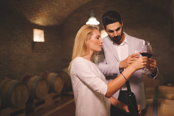 istock People tasting wine in winery basement 979994602