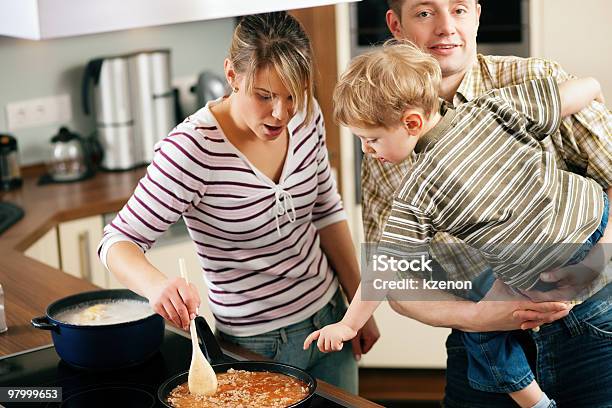 Cooking In Family Stirring The Sauce Stock Photo - Download Image Now - Child, Savory Sauce, Cooking